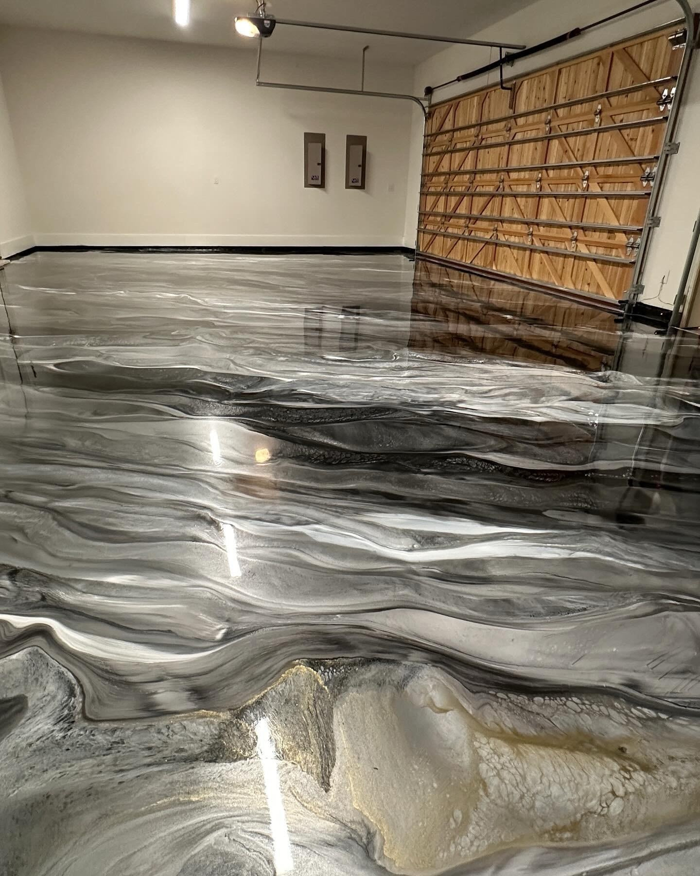 Gray metallic epoxy garage floor with wood door in Cedar City Utah
